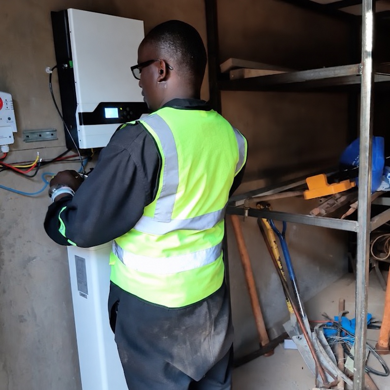 Technician reviewing a power system in the field